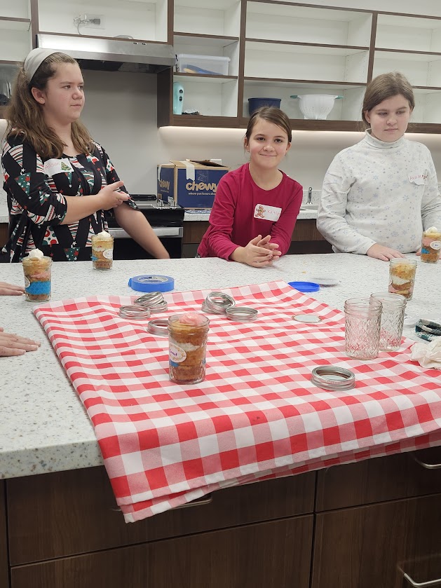 Children making crafts in jars