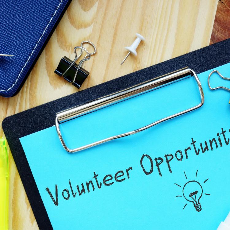  Financial concept meaning volunteer opportunities with sign on the page.