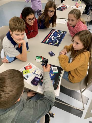 youth playing a board game